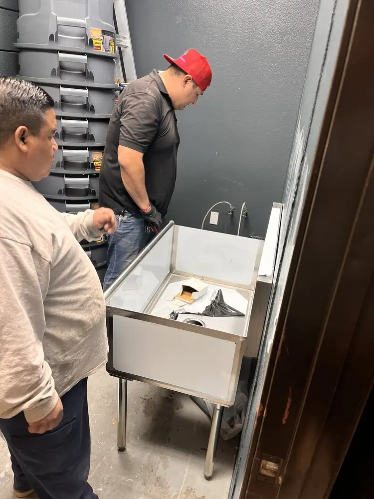 Commercial plumbing and sink installation in Baxter